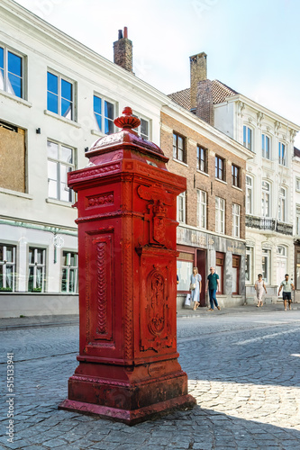Red pillar box in Belgium city of Bruges photo
