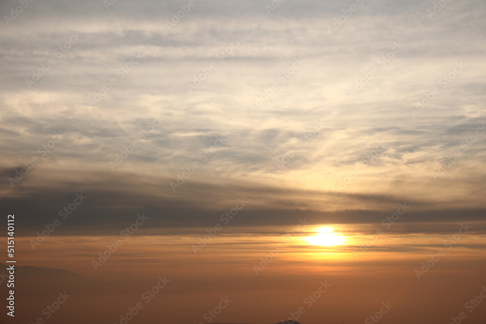 Sunset over the sea. Adorable sunset from the top of the mountain. Sky view with sunset light.
