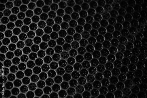 Safety net on the music speaker. Protective grid audio speakers. Close view of Black safety net. Metal perforated mesh, abstract pattern, Abstract black background. Professional audio equipment