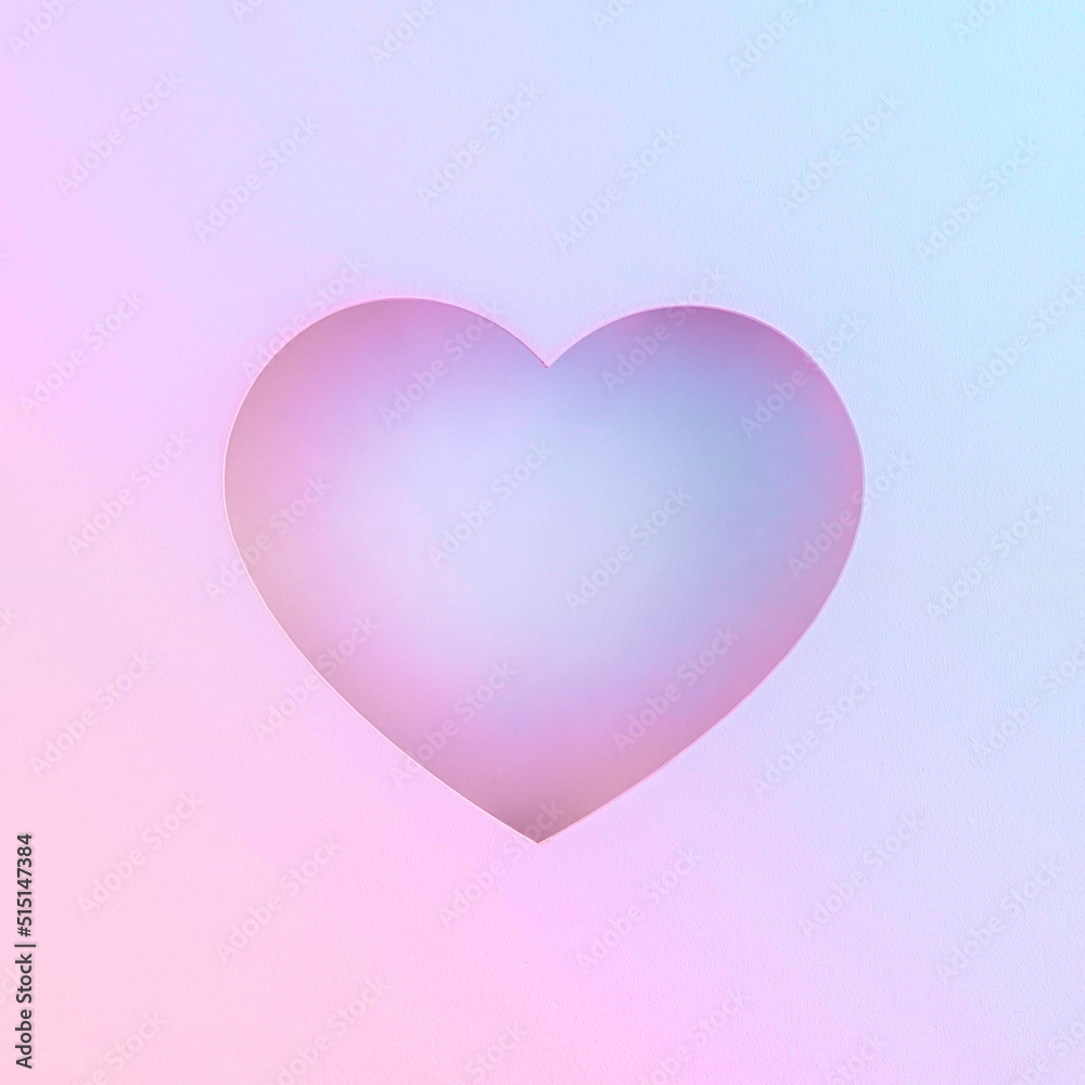 Creative concept made of heart-shaped hole and pastel purple-pink lights. Birthday, wedding or Valentine’s greeting, invitation or gift card. Minimal flat lay. Vaporwave neon background. Love symbol.