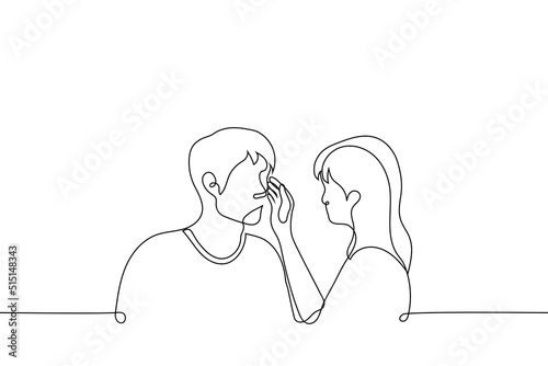 woman touches the man's face. couple looking at each other's eyes - one line drawing vector. woman wipes the tears of a man. concept skinship in a heterosexual couple
