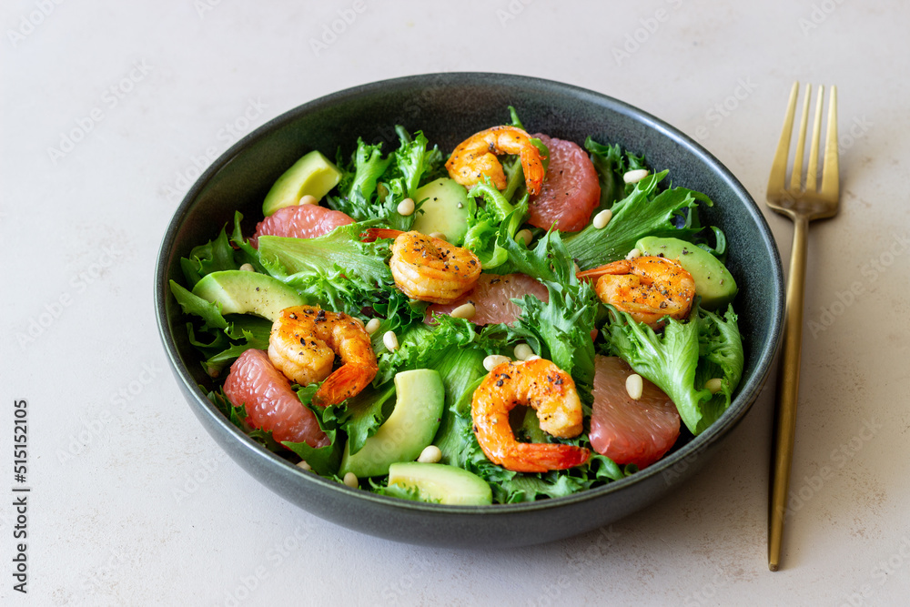 Salad with shrimp, grapefruit, avocado and nuts. Healthy eating. Diet. Salad with shrimp, grapefruit, avocado and nuts. Healthy eating. Diet.