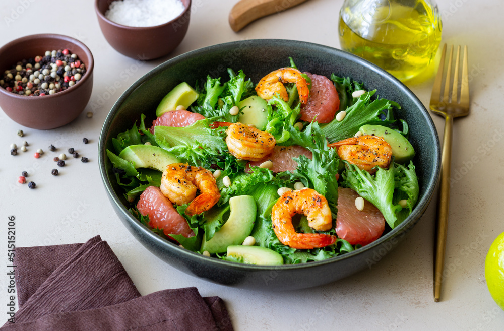 Salad with shrimp, grapefruit, avocado and nuts. Healthy eating. Diet.