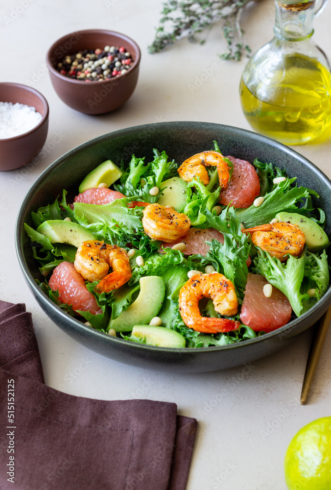 Salad with shrimp, grapefruit, avocado and nuts. Healthy eating. Diet.