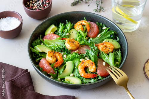 Salad with shrimp, grapefruit, avocado and nuts. Healthy eating. Diet.