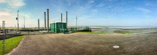 Termunter Zigdiep in Termunterzijl an Ems und Dollart mit Blick auf Windkraftanlagen in Wybelsum photo