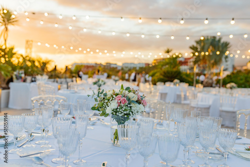 Foto Banquet tables with empty glasses on street