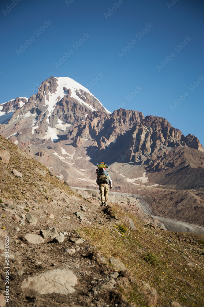 Mountaineering with hiking equipment on the way to meteostation in Kazbek, Georgia Mount kazbek alpinist expedition
