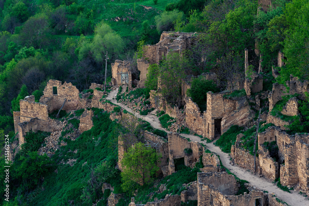 aerial view of the former street among the ruins in the abandoned mountain village of gamsutl in Dagestan