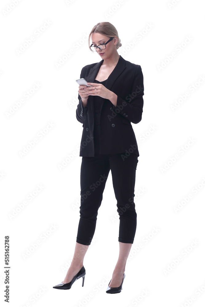 in full growth. businesswoman reading SMS on her smartphone in full growth. businesswoman reading SMS on her smartphone