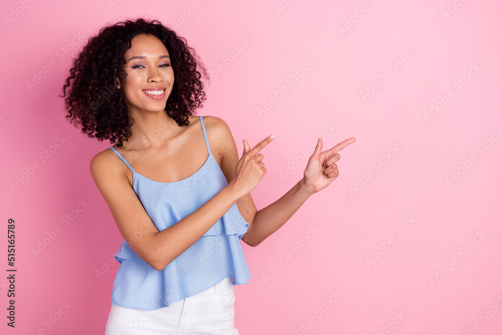 Portrait of gorgeous nice lady toothy smile indicate fingers empty space isolated on pink color background Portrait of gorgeous nice lady toothy smile indicate fingers empty space isolated on pink color background