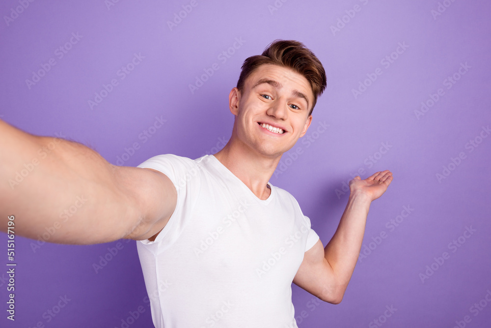 Selfie of handsome young man blogging welcome invite arm copyspace isolated shine color background Selfie of handsome young man blogging welcome invite arm copyspace isolated shine color background