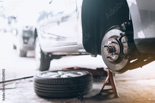 Fotografie, Obraz Repairing the breaks of a car after a street crash