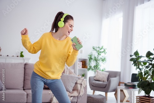 Portrait of attractive cheerful dreamy girl listening single rest relax using gadget having fun singing at home house flat indoors