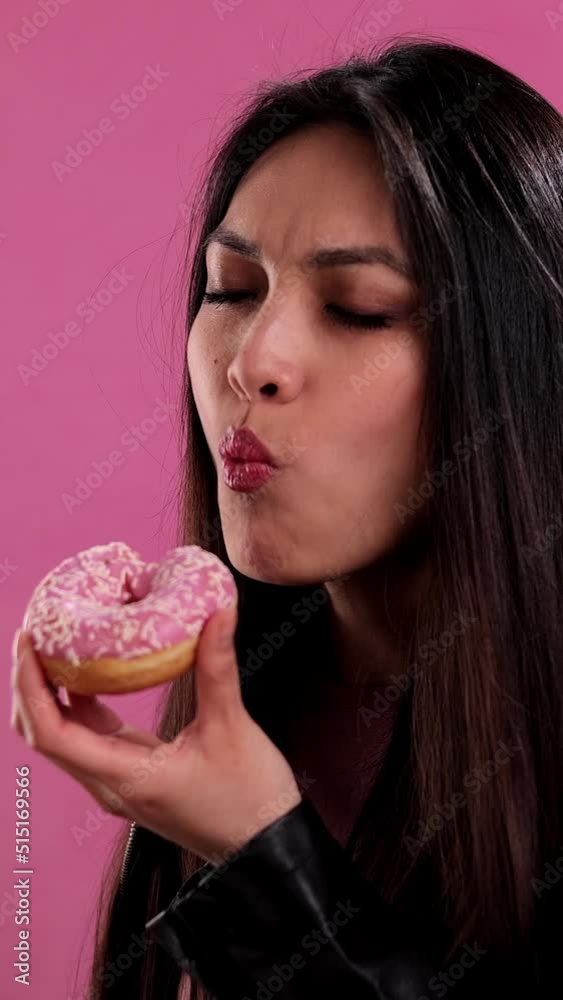 Young pretty woman with freshly baked doughnuts - studio shooting Young pretty woman with freshly baked doughnuts - studio shooting