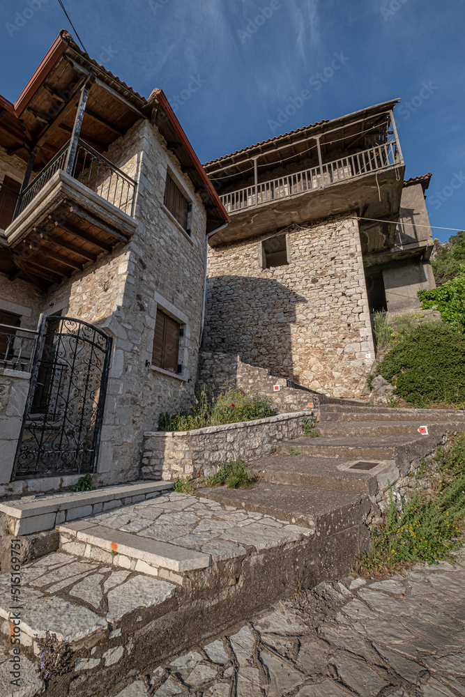 Street view in Dimitsana, a picturesque mountain village, built like am amphitheatre, surrounded by mountain tops, Arcadia, Peloponnes, Greece.