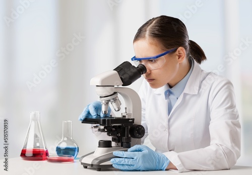 Medical Science Laboratory  Scientist Using Microscope  Does Analysis of Test Sample.