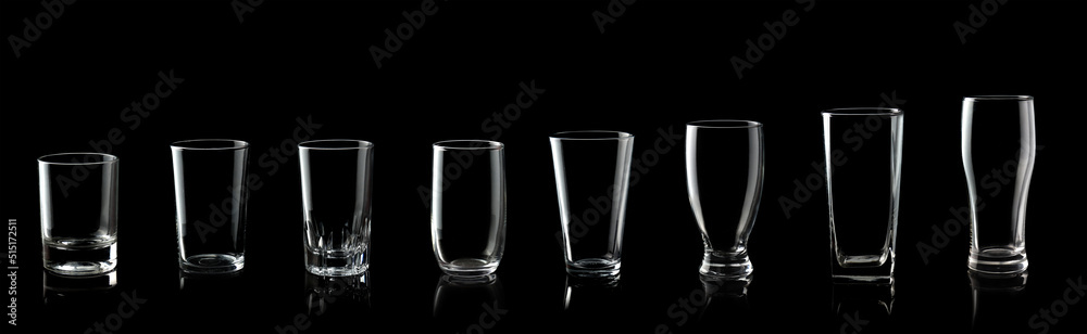 Set of empty glass of water isolated on black background Set of empty glass of water isolated on black background