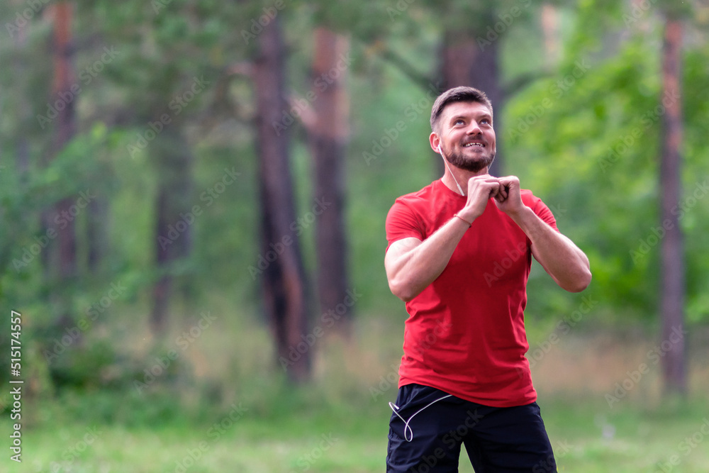 Man runner training. Male athlete stretching muscles at the park. Healthy, fitness, wellness lifestyle. Sport, cardio, workout concept Man runner training. Male athlete stretching muscles at the park. Healthy, fitness, wellness lifestyle. Sport, cardio, workout concept