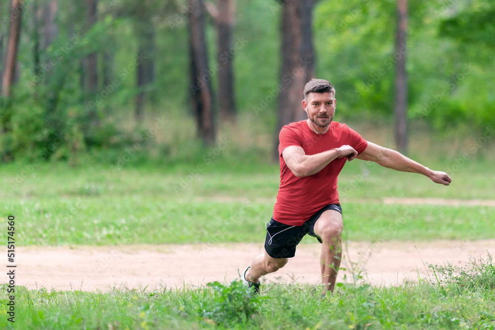 Athletic man runner stretching legs before run. Healthy, fitness, wellness lifestyle. Sport, cardio, workout concept Athletic man runner stretching legs before run. Healthy, fitness, wellness lifestyle. Sport, cardio, workout concept