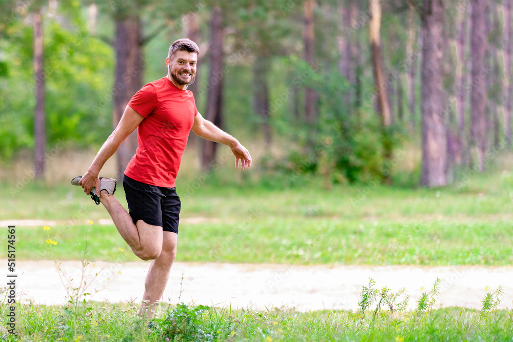 Athletic man runner stretching legs before run. Healthy, fitness, wellness lifestyle. Sport, cardio, workout concept Athletic man runner stretching legs before run. Healthy, fitness, wellness lifestyle. Sport, cardio, workout concept