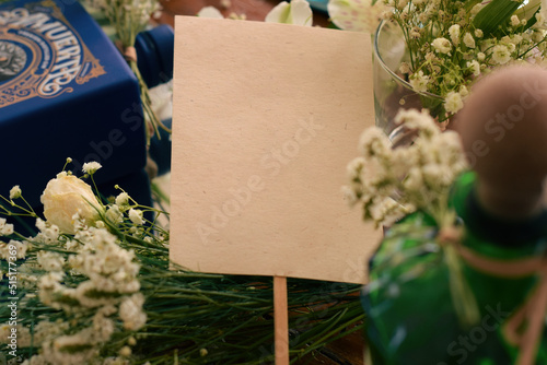 Greeting card with gin bottles and flowers decorations. Copy space, wedding invitations, text overlay