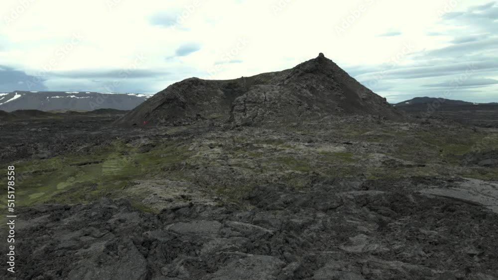 Flying towards a small Caldera surrounded by Volcanic Rocks Flying towards a small Caldera surrounded by Volcanic Rocks
