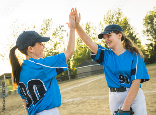 Photography Group of baseball players standing together on the playground giving high five