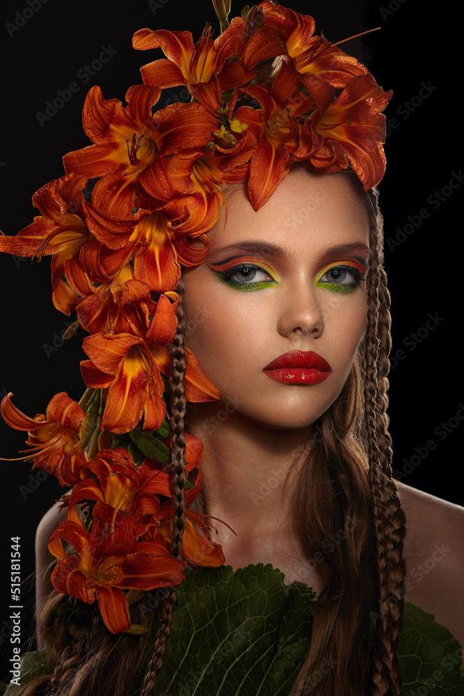 Portrait of a beautiful girl with bright makeup decorated with fresh flowers lilies Portrait of a beautiful girl with bright makeup decorated with fresh flowers lilies