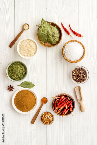 Various powdered spices and herbs in bowls. Cooking background