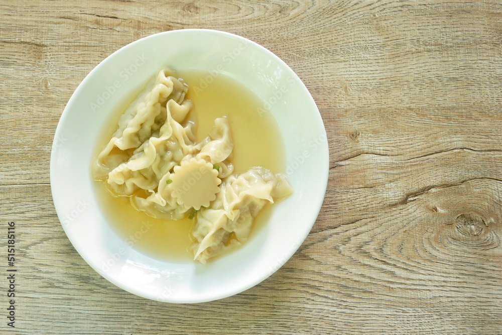Gyoza Japanese boiled dumplings stuffed chop pork in soup on plate Gyoza Japanese boiled dumplings stuffed chop pork in soup on plate