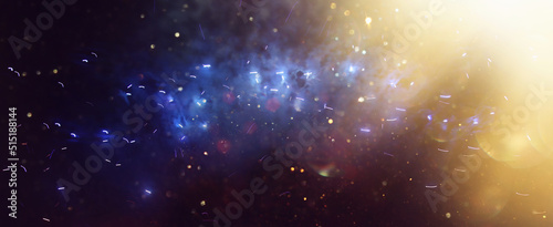 background of abstract gold, black and blue glitter lights with fireworks. defocused photo