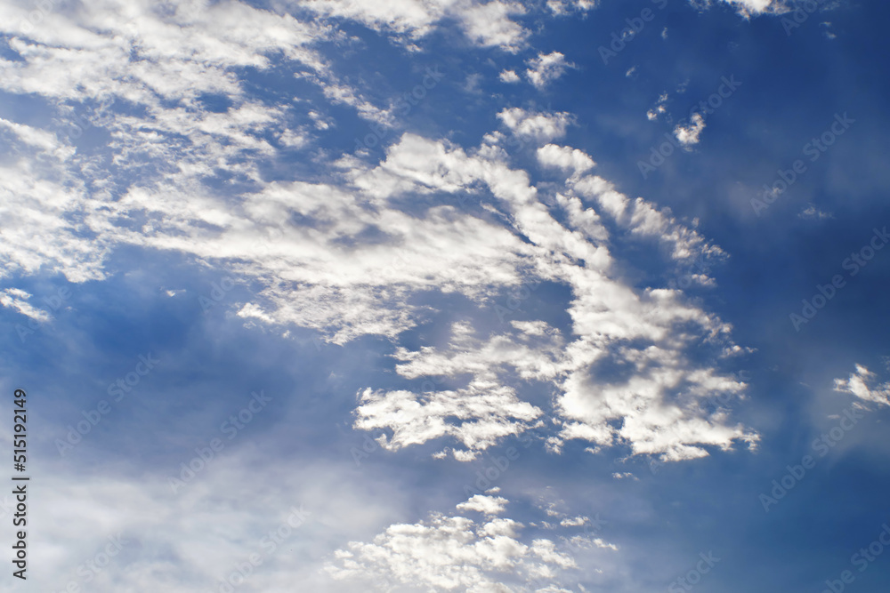 Sunset clouds with sun setting down. Beautiful evening sky with clouds background