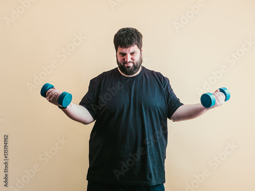 overweight man plays sports with weights