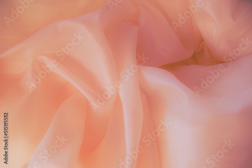 Fabric rose gold waves, material for background and texture. Close up black fabric.