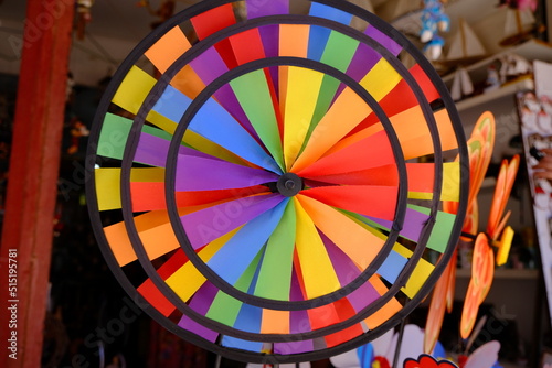 circular windmill painted colorfully like a rainbow. LGBTI+ diversity of colours.