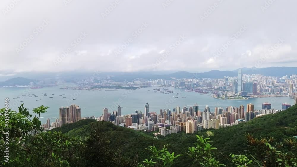 Time lapse of Hong Kong cityscape from above. Clouds over Victoria harbour. Time lapse of Hong Kong cityscape from above. Clouds over Victoria harbour.