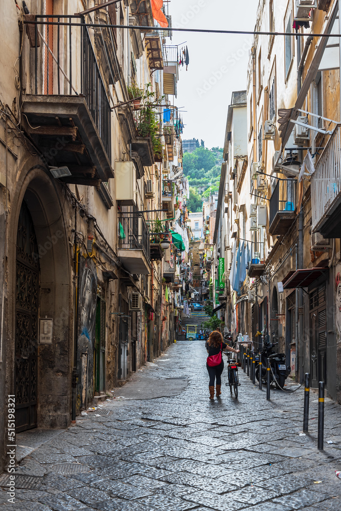 View of typical narrow street at Toledo neighborhood in Naples, Italy - obrazy, fototapety, plakaty 