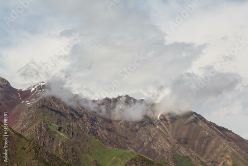 View over the rocky mountain ranges  from Too Ashuu literally "camel pass", is a mountain pass in Kyrgyzstan on the highway from Bishkek to Osh. Kyrgyzstan © Анастасия Смирнова