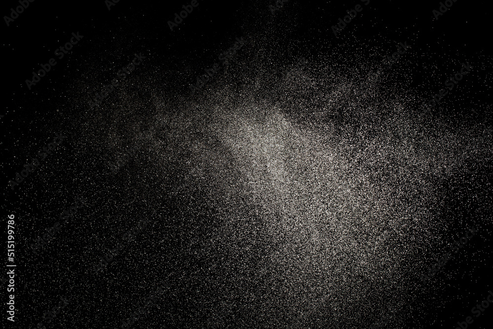 Sprayed water. Small droplets of water in the air. Lots of water drops, isolated on black background. Sprayed water. Small droplets of water in the air. Lots of water drops, isolated on black background.
