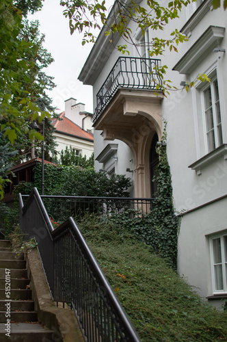 lovely hidden alley with stairs trees ivy and beautiful house