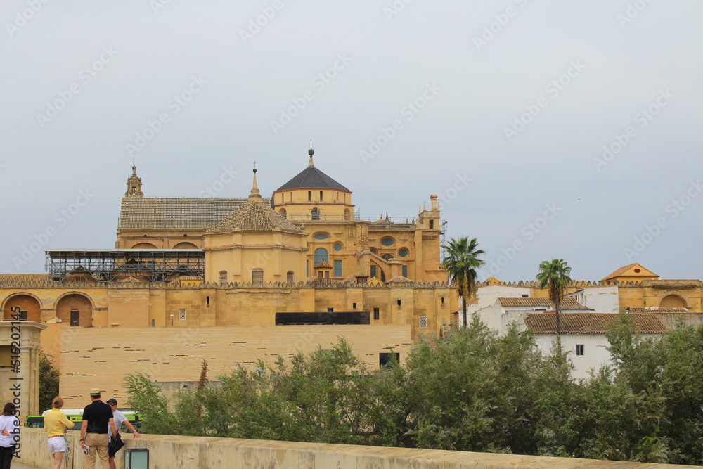 Cordoba, Spain, September 13, 2021: The Roman Bridge with Cordoba Mosque-Cathedral in the background.