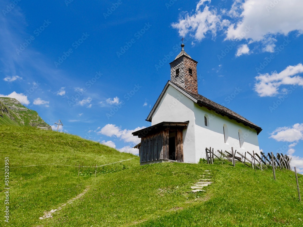 Panoramic view of chapel in ancient Walser village Buerstegg in the Austrian Alps. Lech am Arlberg, Vorarlberg, Austria.