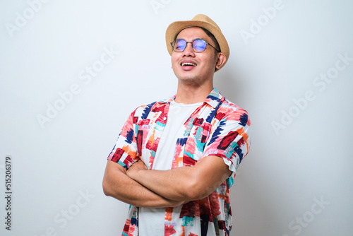 Young handsome man happy face smiling with crossed arms looking at the camera. positive person.