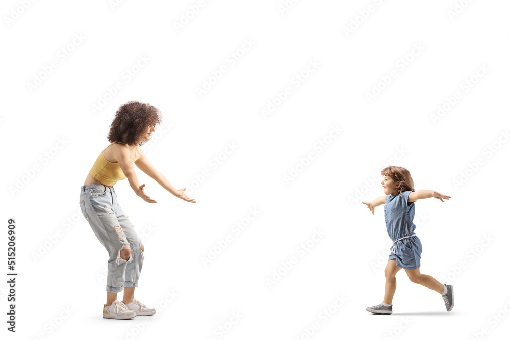 Full length profile shot of a little girl runnuning towards a young female with curly afro hairstyle