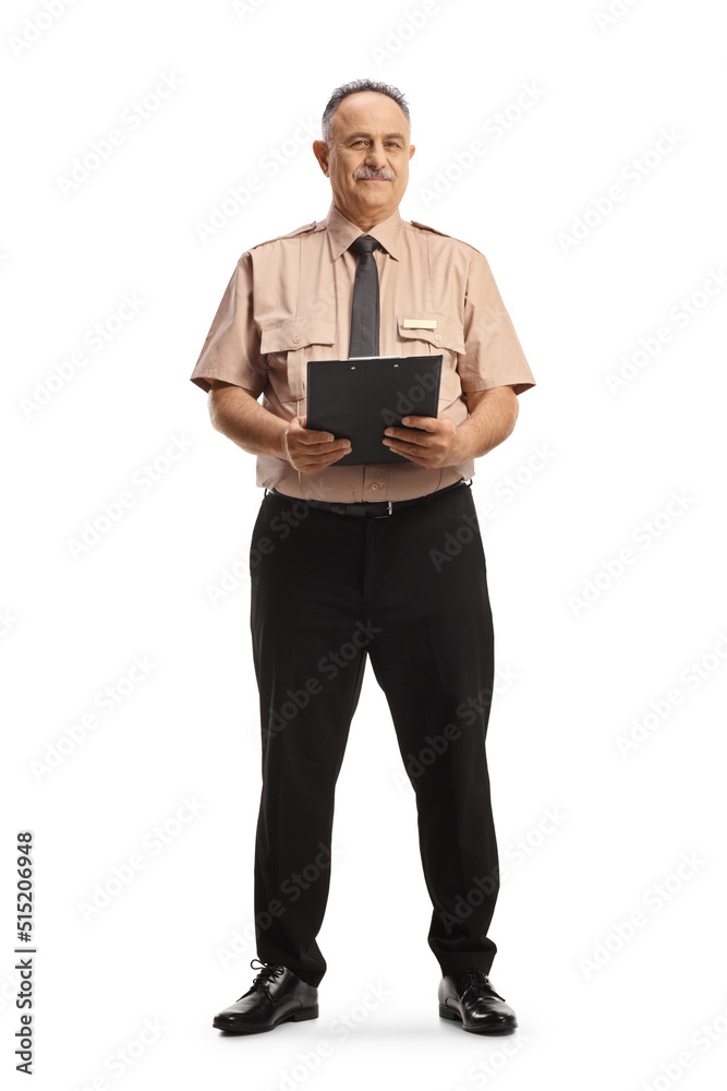 Full length portrait of a mature security guard holding a clipboard and looking at camera Full length portrait of a mature security guard holding a clipboard and looking at camera