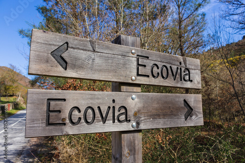 Eco-way direction sign at hiking trail Ecovia do Vez near Arcos de Valdevez, Portugal. Ecovia do Vez wooden pathways along the riverside. © An Instant of Time