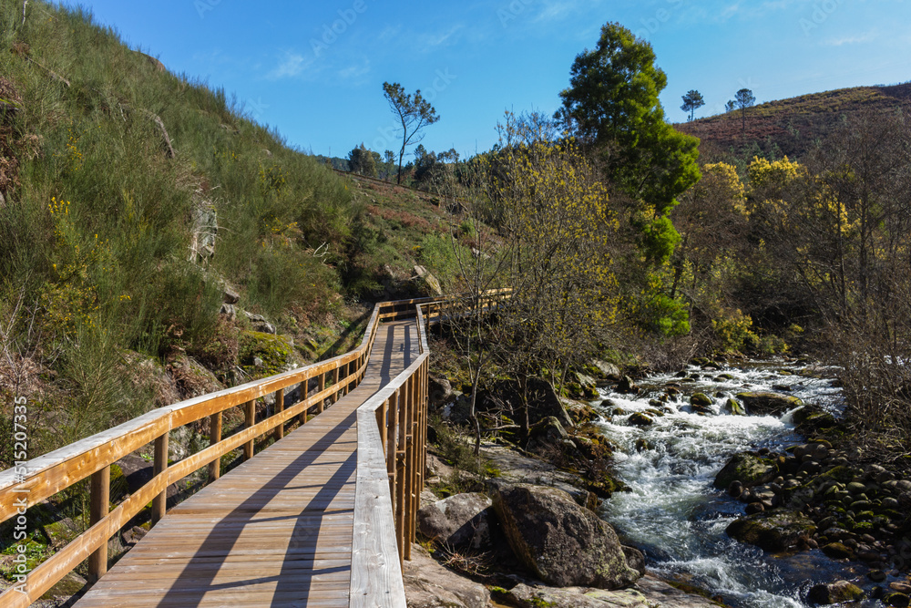 The river hiking trail Ecovia do Vez near Arcos de Valdevez, Portugal. Ecovia do Vez wooden pathways along the riverside. The river hiking trail Ecovia do Vez near Arcos de Valdevez, Portugal. Ecovia do Vez wooden pathways along the riverside.