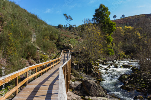 Obraz na płótnie The river hiking trail Ecovia do Vez near Arcos de Valdevez, Portugal. Ecovia do Vez wooden pathways along the riverside. w salonie