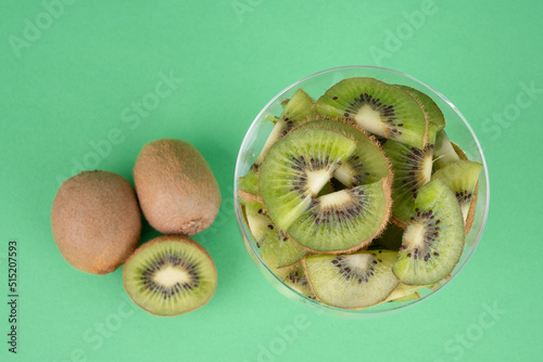 kiwi fruit on green background